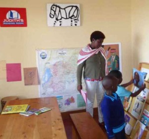 Children at Judith’s Reading Room Muhanga choose from many books—all relevant to Rwanda