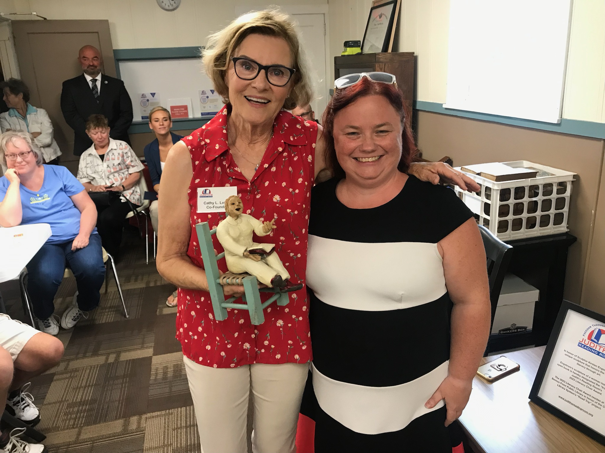 LJ Martin, Outreach & Youth Services, CCLS Library System created “Road Trip” program. She is presented with a Kirsten Engstrom sculpture.